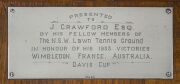 Presentation longcase clock with sterling silver plaque affixed: "PRESENTED TO J. CRAWFORD, ESQ. BY HIS FELLOW MEMBERS OF The N.S.W. Lawn Tennis Ground IN HONOUR OF HIS 1933 VICTORIES : WIMBLEDON : FRANCE : AUSTRALIA : DAVIS CUP". The clock is housed in a - 2