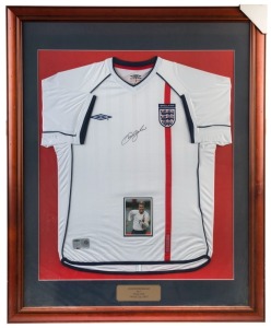 DAVID BECKHAM: display titled "David Beckham, No 7, England, World Cup 2002" featuring English soccer jersey SIGNED BY BECKHAM; framed & glazed, overall 112x92cm. Sportpro Enterprises CofA.