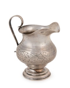 An antique Russian silver creamer with engraved floral design and delicate handle, hallmarked Moscow 1890, 9cm high, 64 grams.