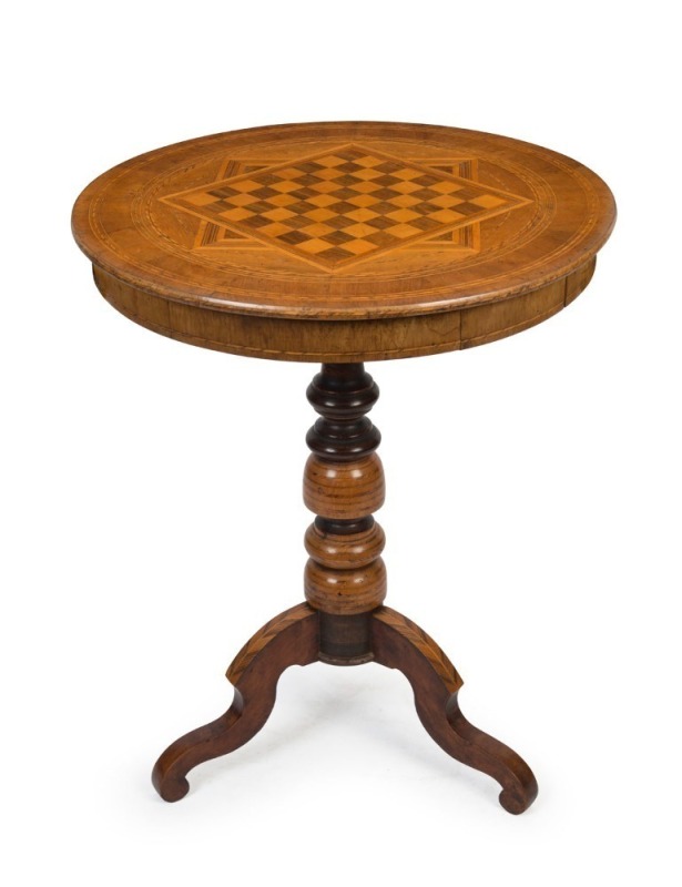 An antique walnut circular games table with chess and gaming pieces, 19th century, 74cm high 60cm diameter