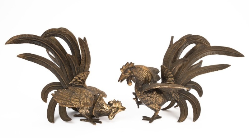 A pair of cast metal cockerel statues, 20th century, the larger 19cm high, 27cm long