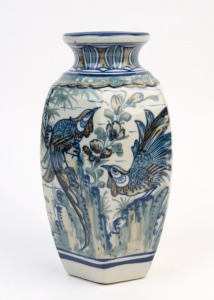 A Persian pottery vase adorned with birds and flowers, 20th century, 28cm high