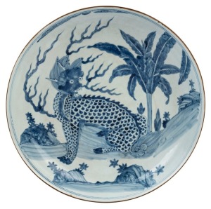 A Chinese blue and white charger with foo dog in landscape decoration, Guangxu Period late 19th century, square seal mark to base, 8cm high, 40cm diameter