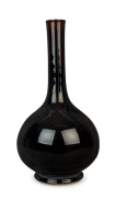 A Chinese jet black porcelain long neck vase, 19th/20th century, 45cm high