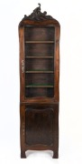 An antique French provincial display cabinet of unusual narrow proportions, 19th century, 210cm high, 55cm wide, 19cm deep