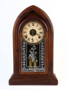 An antique American beehive mantel clock with 8 day time and strike movement, 19th century, 48cm high