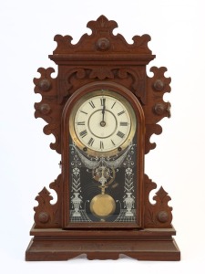 SETH THOMAS American walnut cased mantel clock with 8 day time and strike movement and Roman numerals, 19th century, remains of paper label inside case, 57.5cm high