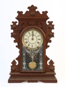 SETH THOMAS American walnut cased mantel clock with 8 day time and strike movement and Roman numerals, 19th century, remains of paper label inside case, 57.5cm high