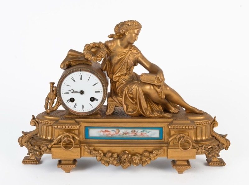 A French antique gilt metal figural mantel clock with time and strike movement and Sevres porcelain panel, 19th century, ​​​​​​​30cm high 41cm wide