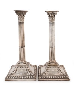 A pair of Georgian sterling silver Corinthian column candlesticks, London, circa 1759, weighted bases, 29.5cm high