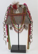 AKHA 'PHAMI' HEADDRESS: Made from Yunnan "Dragon" coins, 19th century Burmese glass beads, hand-made silver moon-shaped buttons, chains, pendants, tassels; gibbon fur; red-dyed chicken hackles and horsehair. circa 1930s. - 4