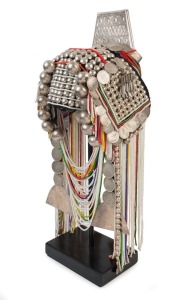 AKHA LOHMI HEADDRESS: Made from Indian Rupees, "Fat Man Dollars", French Indochinese Piastre coins, 20th century Burmese beads, hand-made silver moon-shaped buttons, chains, pendants, tassels, red-dyed chicken hackles and horse hair, circa 1950s.