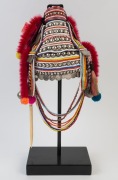 AKHA "U-LO" HEADDRESS: Made from Indian Rupees, French Indochinese coins, 20th century Burmese beads, hand-made silver moon-shaped buttons, pendants, tassels, red-dyed chicken hackles, horse hair, animal bone and wool, circa 1950s. 45cm high, 830 grams to - 2