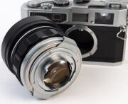 Canon Model 7 rangefinder camera, 1961 [#938125] with Canon 50mm f0.95 lens [#21939], Canon Accessory Coupler and Canon 50 optical viewfinder; the lens additionally with UV 1x filter and lens hood. - 6