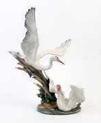 LLADRO Spanish porcelain figural crane group, A/F, blue factory mark to base, 48cm high, 45cm wide