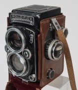 ROLLEI: Rolleiflex 2.8E twin-lens reflex camera [#1636122], circa 1956 with Zeiss Planar lens, with metal caps in maker's leather ERC. With manuals. - 3