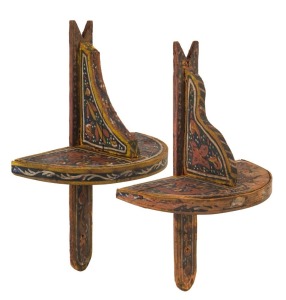 A pair of Ottoman painted wooden wall mounts (Kavukluk) of classic form adorned with polychrome pigments. Used to store turbans on when they are not being worn in the house. One bears an old collection number on the front surface in black ink, the other traces of an old collection label. Circa 19th century A.D. approximately 45cm high