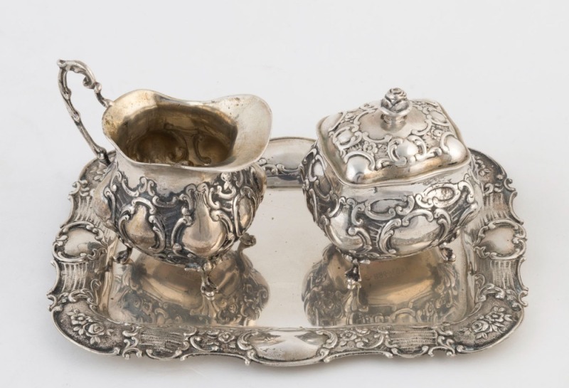 German silver cream jug, lidded sugar bowl and tray, 20th century (3 items), stamped "800" with crown and crescent marks, the tray 27cm wide, 460 grams total weight