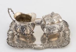 German silver cream jug, lidded sugar bowl and tray, 20th century (3 items), stamped "800" with crown and crescent marks, the tray 27cm wide, 460 grams total weight