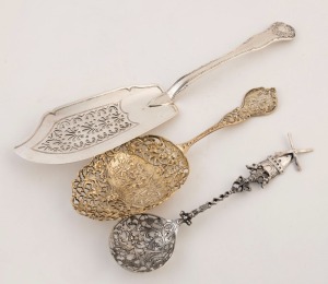 An English sterling silver fish server, together with two Dutch silver servers, (3 items), the fish server 31cm long,