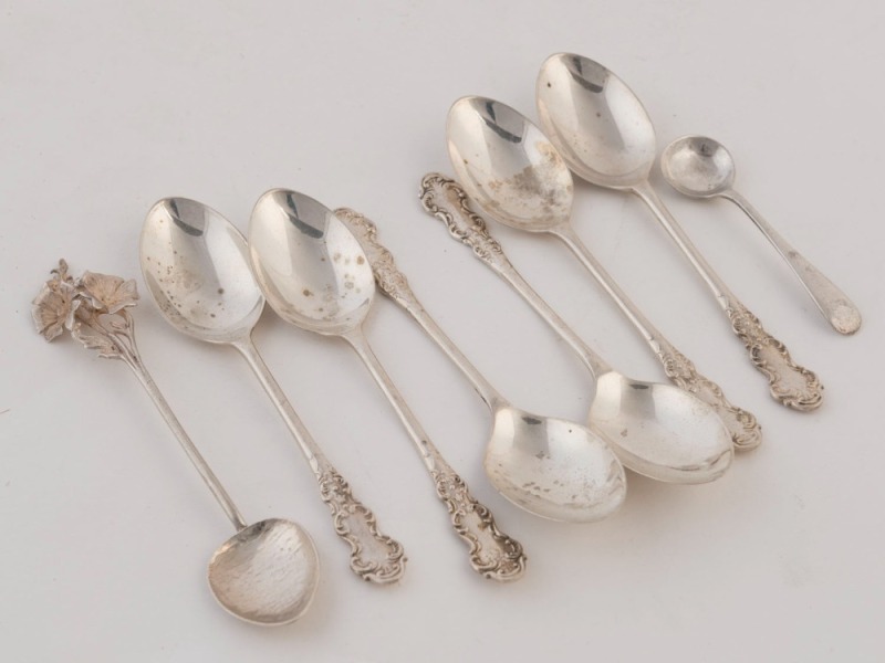 An Australian silver teaspoon, a sterling silver condiment spoon, and a set of six English sterling silver teaspoons, 20th century, the largest 11.5cm high, 86 grams total