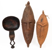 Two tribal masks and a food bowl, carved wood with ochre and clay decoration, Papua New Guinea, ​​​​​​​the largest 63cm high