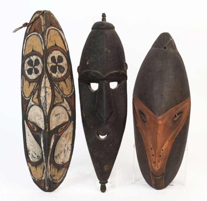 Three tribal masks, carved and painted wood, Papua New Guinea, the largest 42cm high