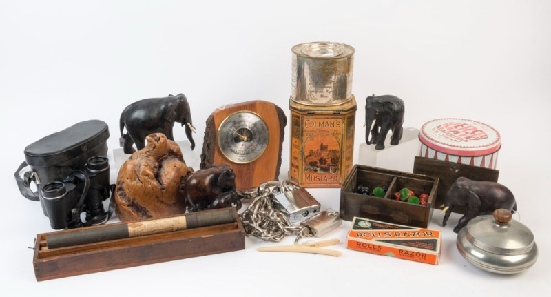 Carved wooden elephants, cast metal chess pieces, chain and padlock, binoculars, clock and tins, (11 items)