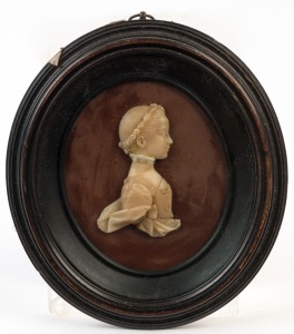 An antique wax relief profile portrait in oval frame, early 19th century, ​​​​​​​16 x 14cm overall