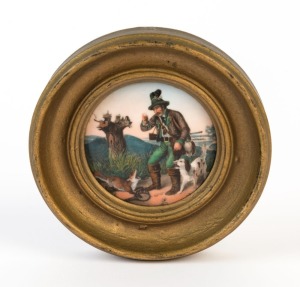 An antique German porcelain miniature circular plaque of a huntsman and dogs, mid 19th century, ​​​​​​​6.5cm diameter, 11cm diameter overall