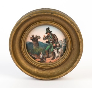 An antique German porcelain miniature circular plaque of a huntsman and dogs, mid 19th century, 6.5cm diameter, 11cm diameter overall