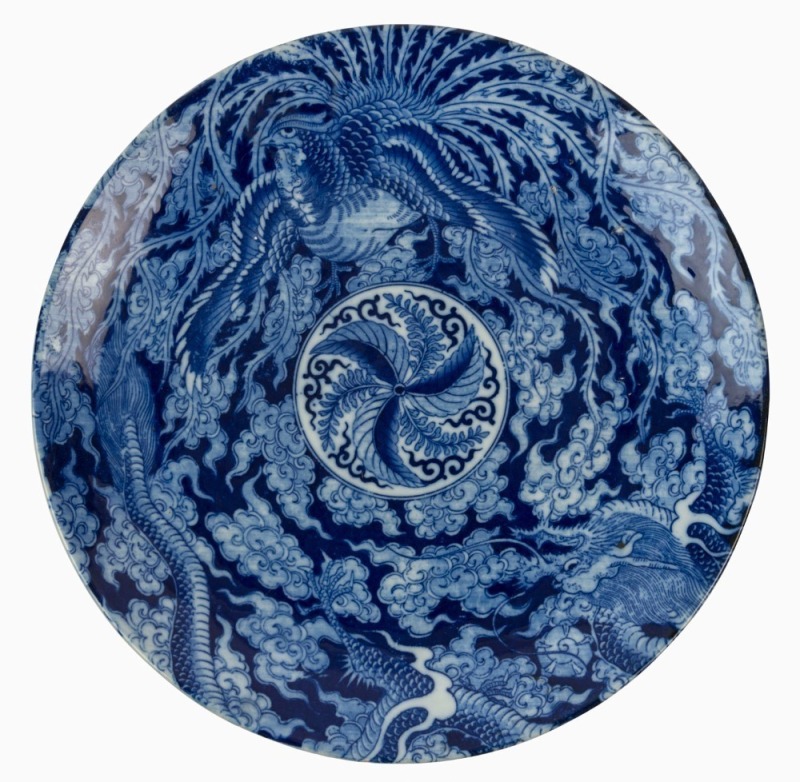 A Chinese porcelain charger profusely decorated in underglaze blue with scene of a five clawed dragon and phoenix in clouds, early 20th century, underglaze blue four character mark and incised mark to base, ​​​​​​​36.5cm diameter