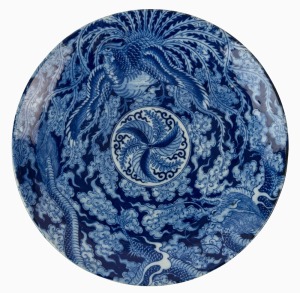 A Chinese porcelain charger profusely decorated in underglaze blue with scene of a five clawed dragon and phoenix in clouds, early 20th century, underglaze blue four character mark and incised mark to base, 36.5cm diameter