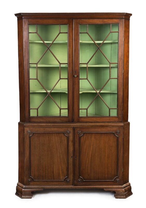 A Georgian mahogany corner display cabinet with astragal glazed doors, early 19th century, ​​​​​​​186cm high, 118cm wide, 64cm deep