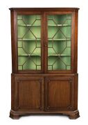 A Georgian mahogany corner display cabinet with astragal glazed doors, early 19th century, ​​​​​​​186cm high, 118cm wide, 64cm deep