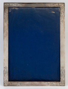 A sterling silver picture frame with blue velvet backing, early 20th century, 37 x 24cm
