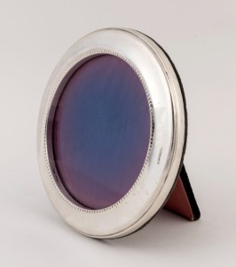 A vintage English sterling silver circular picture frame, 20th century, 11.5cm diameter