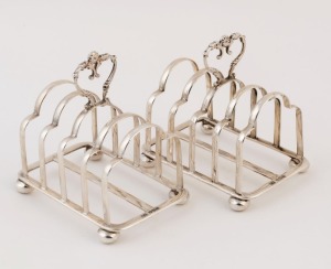 A pair of English sterling silver toast racks by Atkins Brothers of Sheffield, circa 1886, ​​​​​​​10cm high, 9cm wide