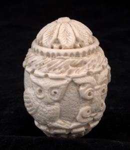 An antique carved ivory egg ornament adorned with owls and floral designers, 18th/19th century, ​​​​​​​6.5cm high