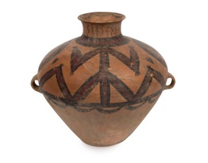 A Chinese lugged Neolithic painted clay vessel with geometric designs within spheres and large stylized figures extend upwards towards the flared spout. Neolithic Culture, circa 3rd to 2nd millennium B.C. 37cm high