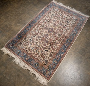 A Persian hand-knotted floral pattern rug with blue and cream ground, Hali Rug Gallery label verso, ​​​​​​​260 x 160cm