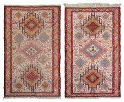 Two hand-knotted flat weave tribal patterned rugs. 42 x 100cm each