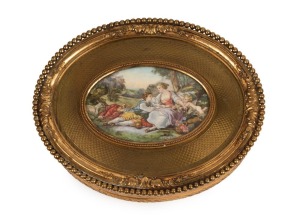 An antique French oval jewellery casket, gilt bronze with hand-painted scene on ivory, 19th century, stamped "FRANCE" on the base, 5cm high, 16.5cm wide, 13cm deep