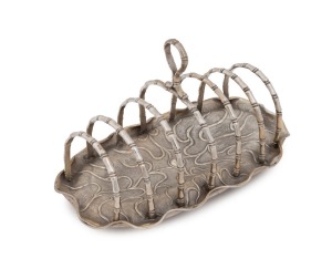 A Chinese silver toast rack of lotus leaf and bamboo form, by WANG HING, early 20th century, 9cm high, 16cm wide, 169 grams. PROVENANCE: Purchased from Honeychurch Antiques, Hong Kong.
