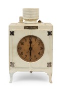 GENERAL ELECTRIC "Refrigerator" electric clock in painted cast metal case, mid 20th century, 22cm high