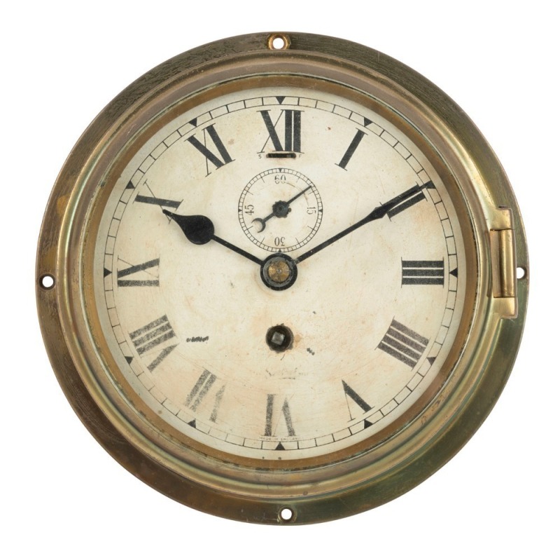 An antique English circular brass cased porthole clock, timepiece only with card dial, Roman numerals and subsidiary seconds dial, 19th/20th century, ​​​​​​​20cm diameter overall