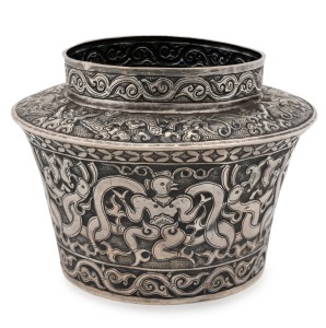 An antique Vietnamese Cham Silver offering bowl, finely decorated in repoussé with four human figures/dancers with bird-like faces, interspersed with four sets of two intertwined phoenix images. The shoulder has four serpents/nagas interspersed with four cloud motifs. The neck and base decorated with scrolling wave motifs. An extremely rare bowl of exquisite workmanship. Champa, 18th/19th century or possibly earlier, 9.5cm high, 13cm diameter, 161 grams.