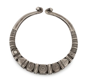 An antique Indian tribal silver torque neckring (hussli), border of the Sind/Indus Valley, Rajasthan, 19th/20th century. Cast solid silver, finely chased and incised with various lobes and geometric patterns. 15cm wide, an impressive 663 grams total, (23.4 oz. in the old scale). PROVENANCE: Private Collection Melbourne. Purchased Bombay (Mumbai), 21st April, 1988.