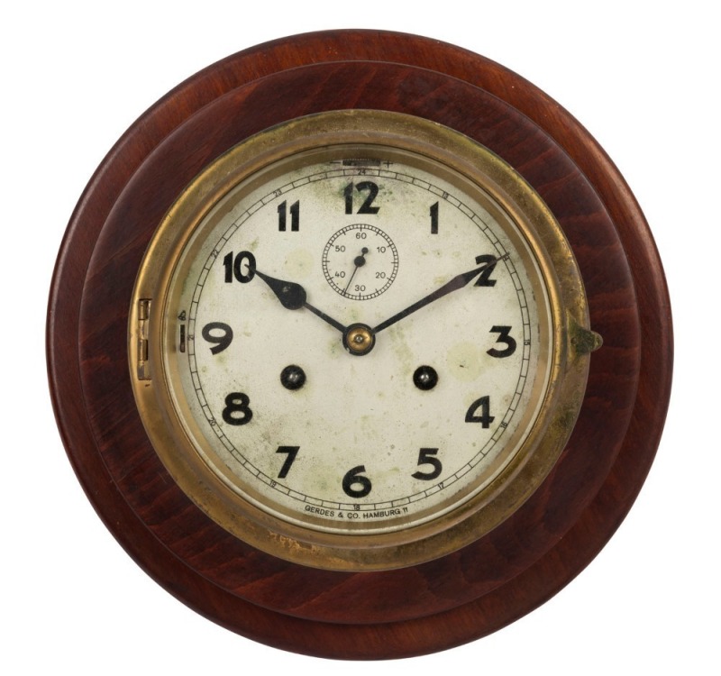 GERDES & Co. of Hamburg ship's bulkhead clock in brass case, with later wooden mount, 19th/20th century, the clock 18cm diameter, 28cm diameter overall