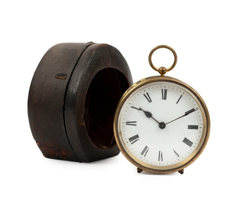 An antique French travelling timepiece clock in circular brass case with Roman numerals, in leather case, 19th century, ​​​​​​​10cm high